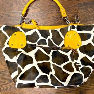 Massini cow print leather tote.